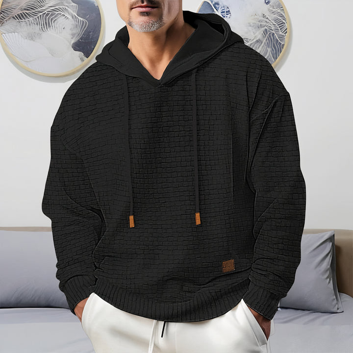 Men's warm hooded sweater, perfect for layering and staying cozy on autumn days.







