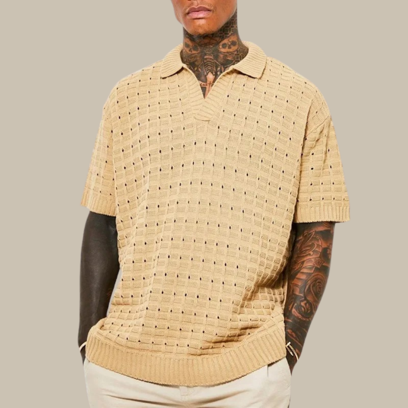 Trendy men's knitted polo shirt with breathable fabric and modern fit, perfect for casual and smart looks during summer days.