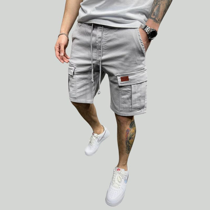 Breezy cotton cargo shorts for men with breathable fabric and multiple pockets, ideal for staying cool on summer days.