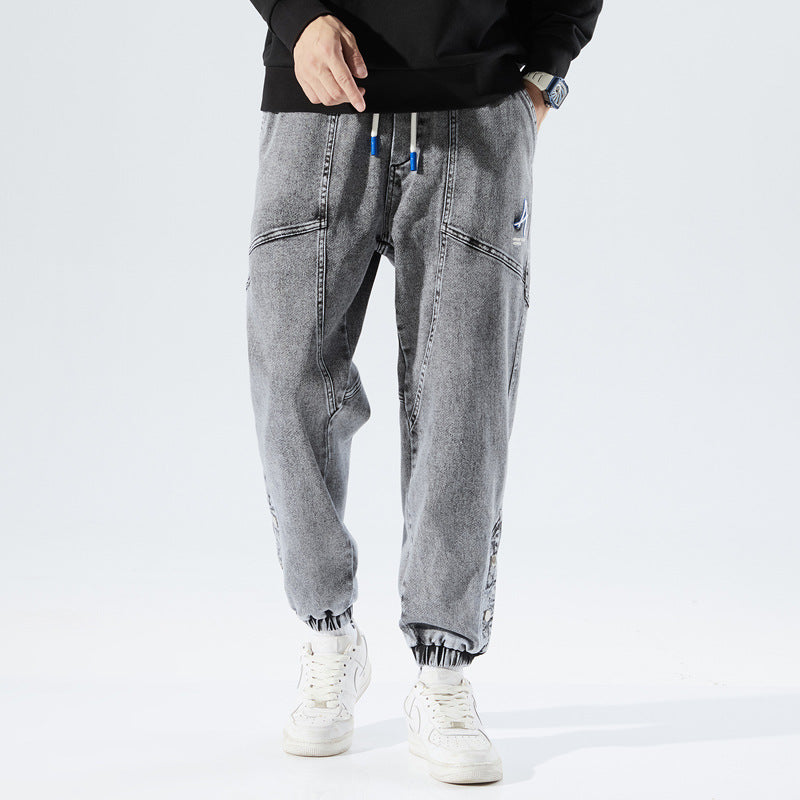 Casual trendy denim joggers for men with a comfortable fit and stylish tapered design, ideal for summer days.