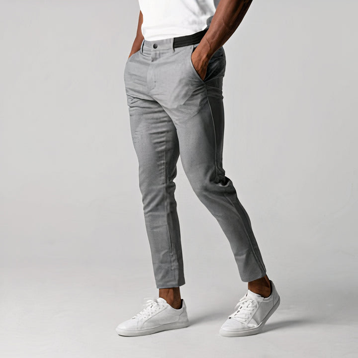 Chic slim-fit men's trousers with breathable fabric, tailored design, stretchable material, and versatile style, perfect for professional or casual wear on summer days.