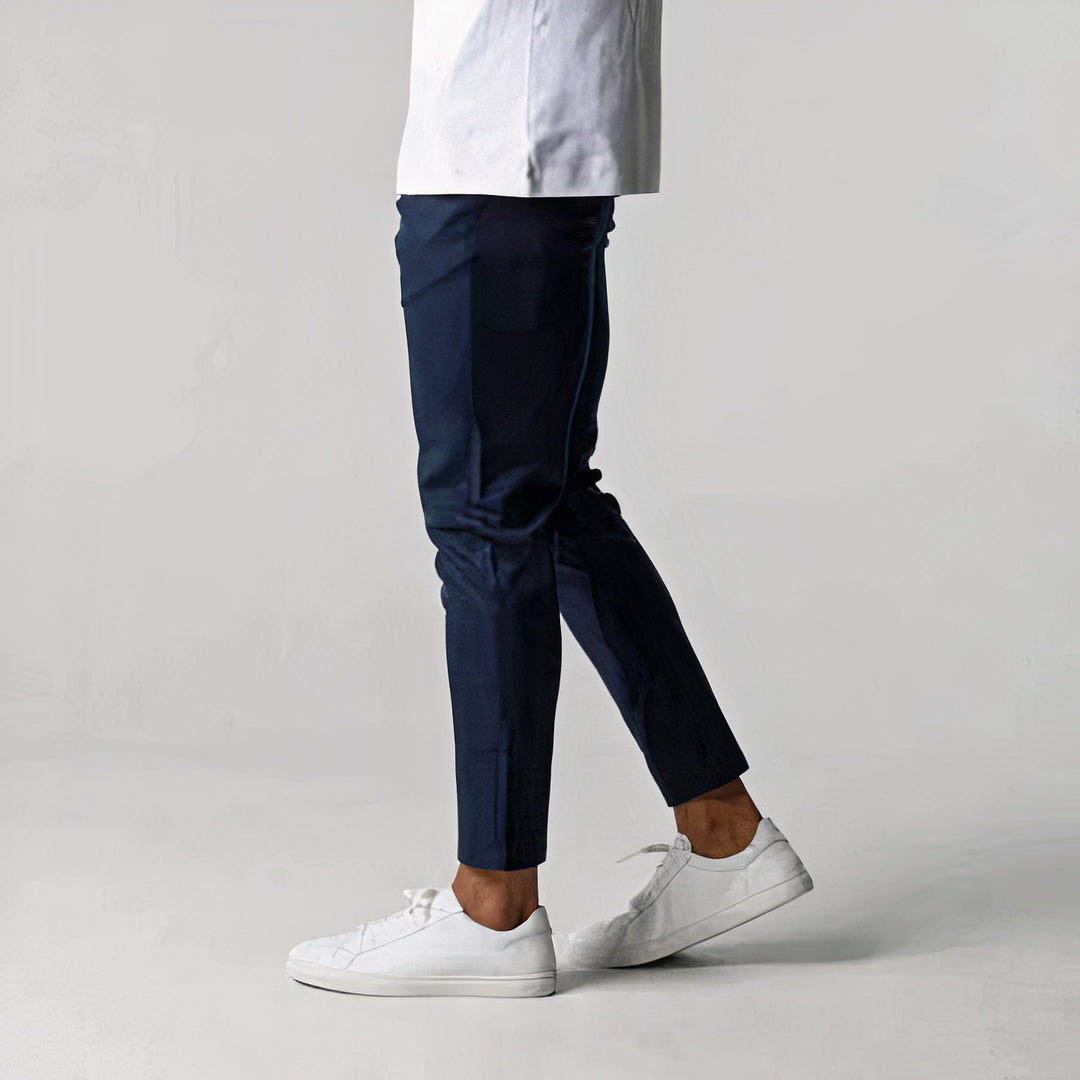 Chic slim-fit men's trousers with breathable fabric, tailored design, stretchable material, and versatile style, perfect for professional or casual wear on summer days.