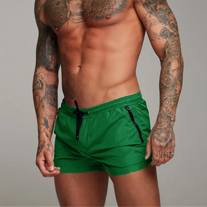 Classic beach shorts for men with breathable, quick-drying fabric and adjustable waistband, perfect for summer beach outings and casual wear.






