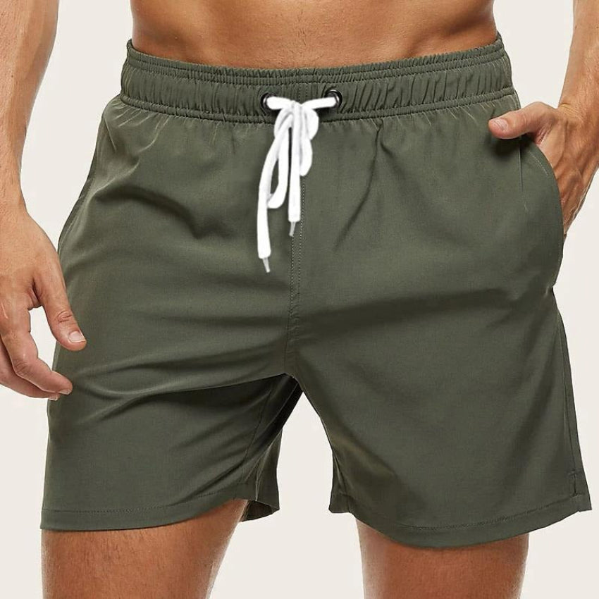 Classic men's swimming shorts with quick-drying fabric and adjustable waistband, ideal for summer days and water activities.






