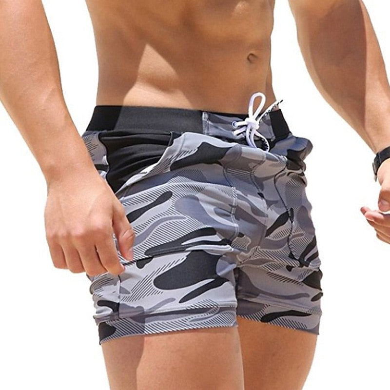 Men's classic swimming boardshorts with quick-drying fabric, adjustable waistband, and breathable design, ideal for beach and pool days.