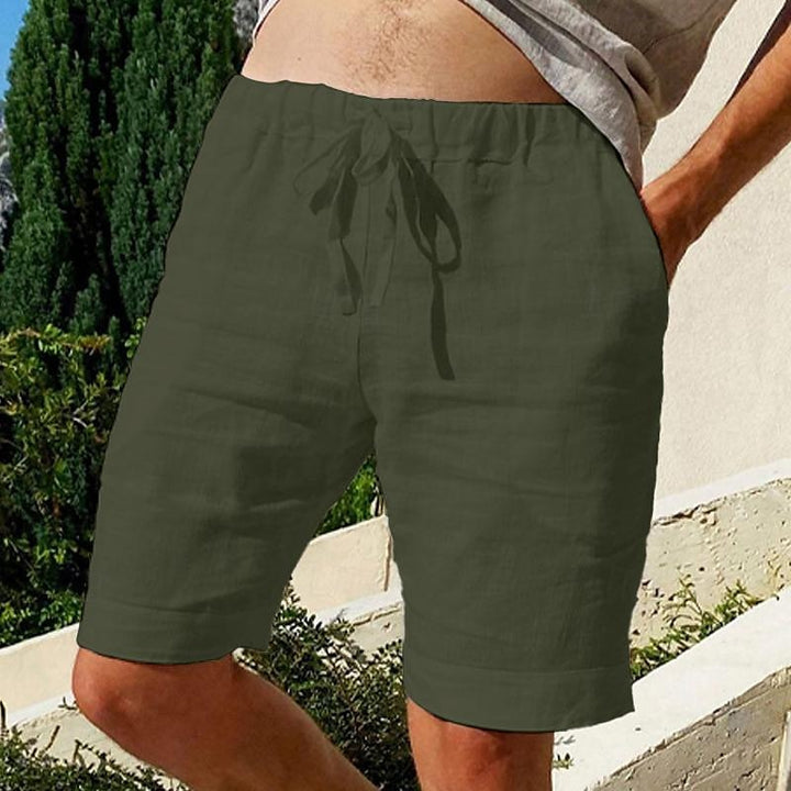 Comfy linen beach shorts with elastic waistband and lightweight, breathable fabric, perfect for summer relaxation.