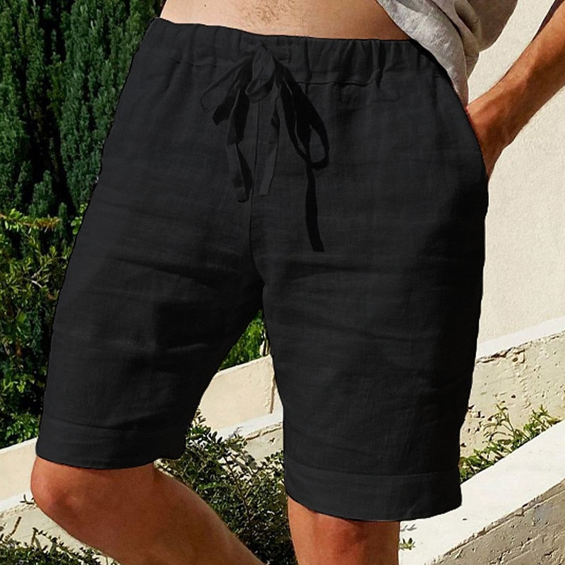 Comfy linen beach shorts with elastic waistband and lightweight, breathable fabric, perfect for summer relaxation.