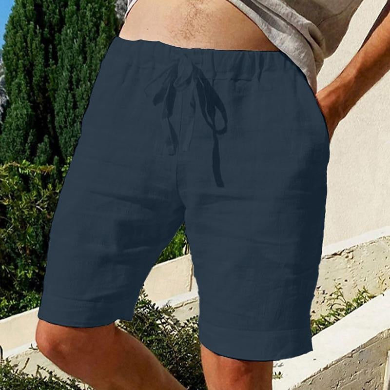 Comfy linen beach shorts with elastic waistband and lightweight, breathable fabric, perfect for summer relaxation.