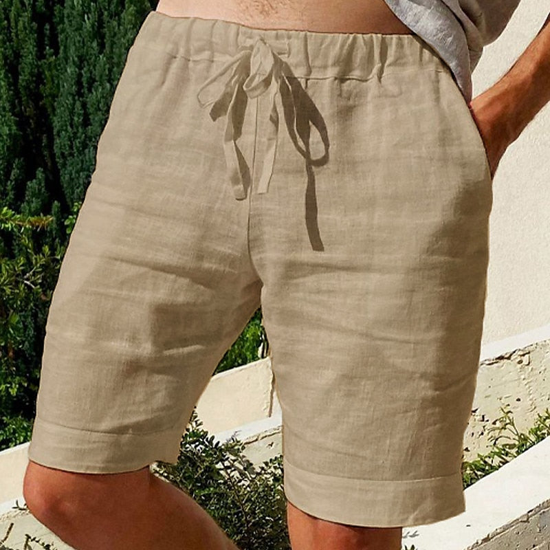 Comfy linen beach shorts with elastic waistband and lightweight, breathable fabric, perfect for summer relaxation.