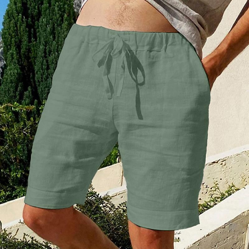 Comfy linen beach shorts with elastic waistband and lightweight, breathable fabric, perfect for summer relaxation.