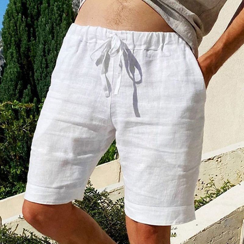 Comfy linen beach shorts with elastic waistband and lightweight, breathable fabric, perfect for summer relaxation.