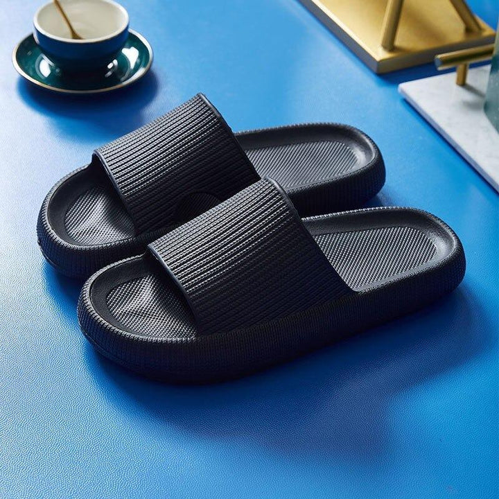 Comfy men's slides with cushioned footbed, slip-on design, and breathable material for summer.