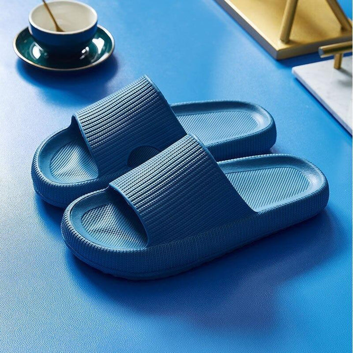 Comfy men's slides with cushioned footbed, slip-on design, and breathable material for summer.