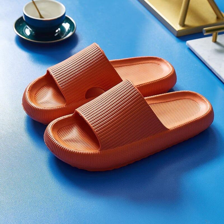 Comfy men's slides with cushioned footbed, slip-on design, and breathable material for summer.