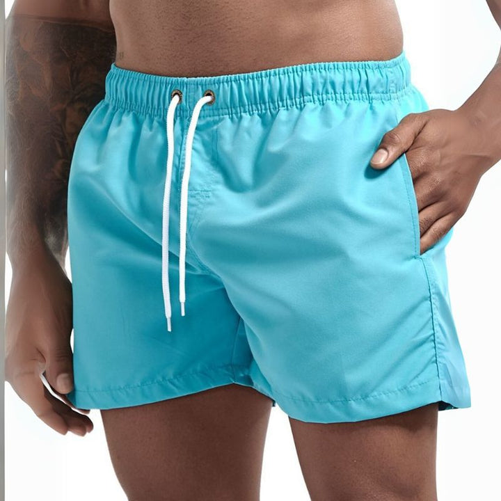 Cool drawstring beach shorts with lightweight fabric and adjustable waistband, perfect for summer days and seaside adventures.