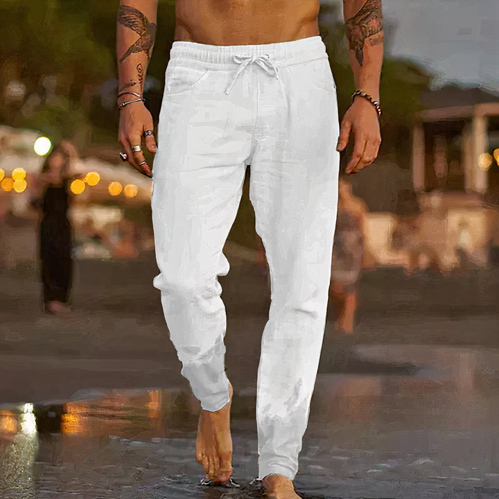 Linen trousers designed for summer with breathable fabric, relaxed fit, timeless style, and moisture-wicking properties, perfect for staying cool and stylish on warm days.