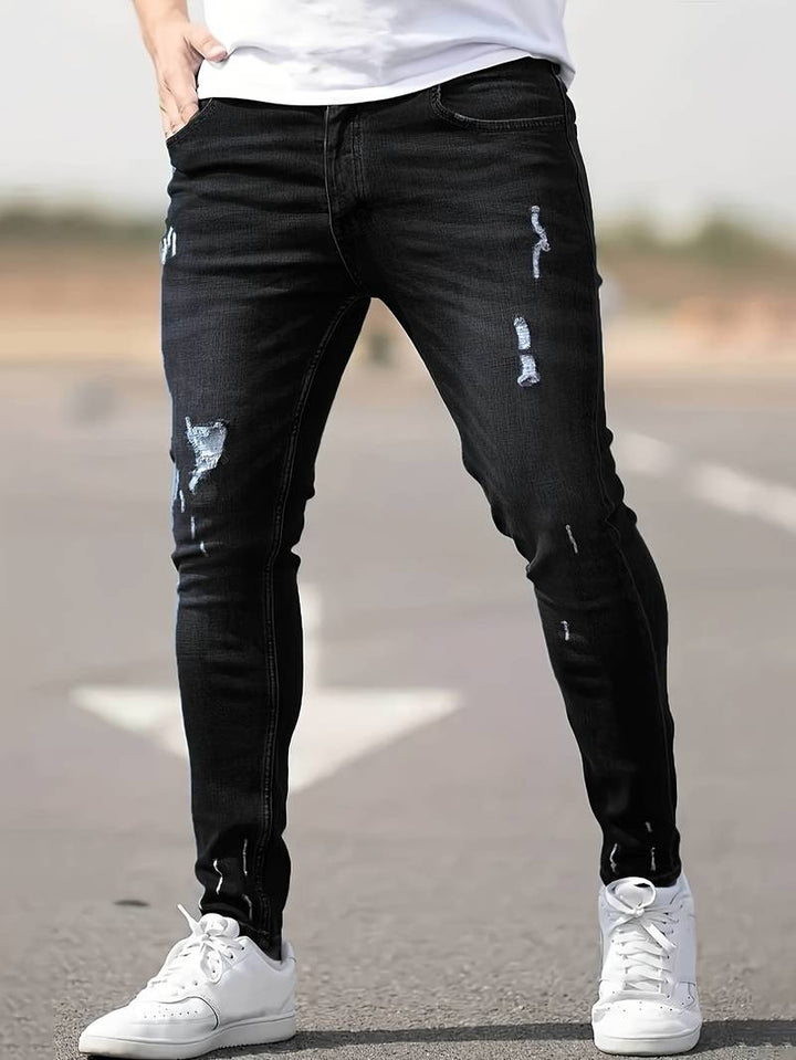 Men's classic ripped denim jeans with a trendy design, durable fabric, and comfortable fit, perfect for casual and summer looks.






