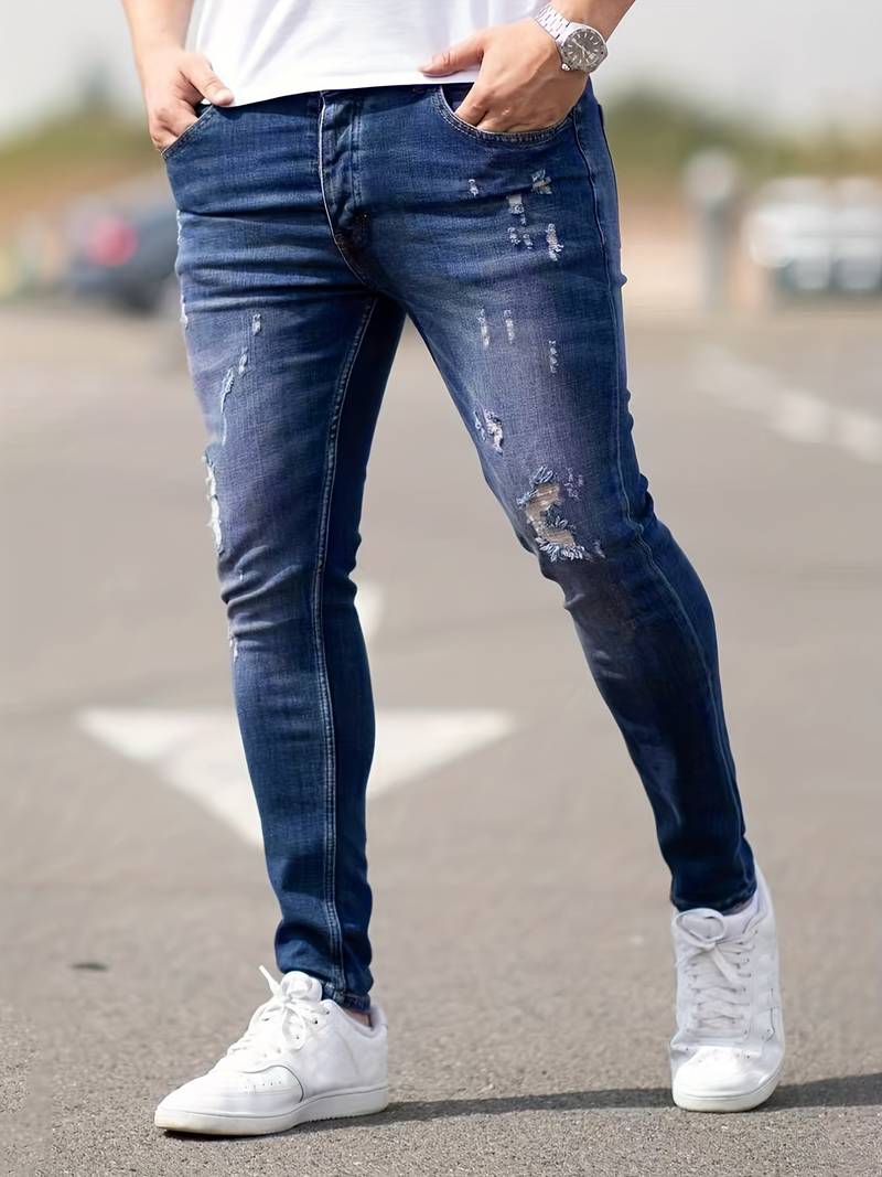 Men's classic ripped denim jeans with a trendy design, durable fabric, and comfortable fit, perfect for casual and summer looks.






