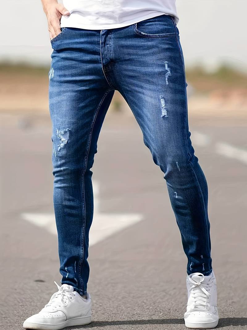 Men's classic ripped denim jeans with a trendy design, durable fabric, and comfortable fit, perfect for casual and summer looks.






