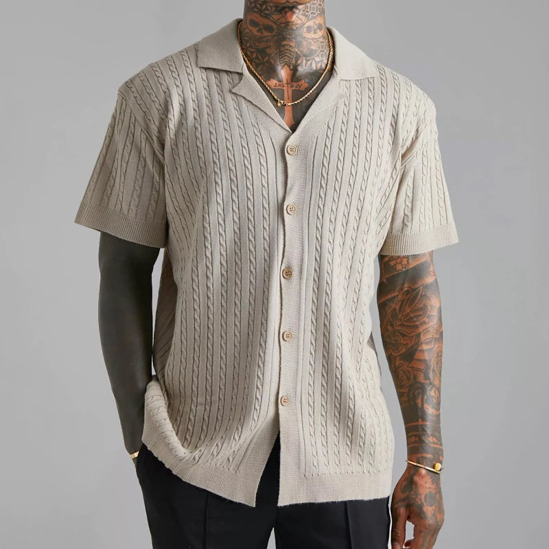 Men's elegant knitted button-up shirt featuring breathable fabric and a refined design, ideal for stylish summer wear.