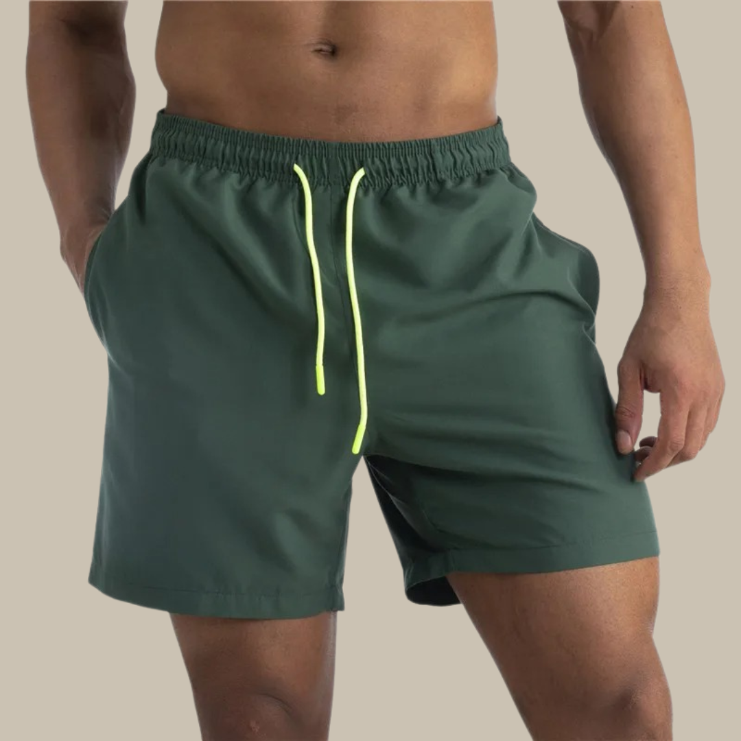 Men's casual quick-drying swim shorts with elastic waistband and lightweight design, ideal for active summer days by the water.






