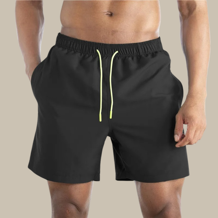 Men's casual quick-drying swim shorts with elastic waistband and lightweight design, ideal for active summer days by the water.






