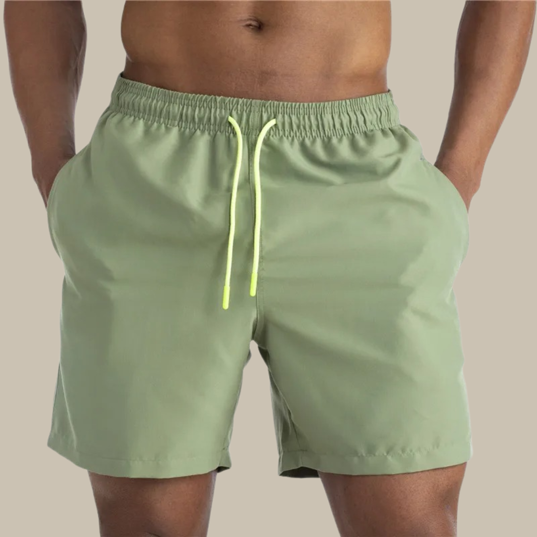 Men's casual quick-drying swim shorts with elastic waistband and lightweight design, ideal for active summer days by the water.






