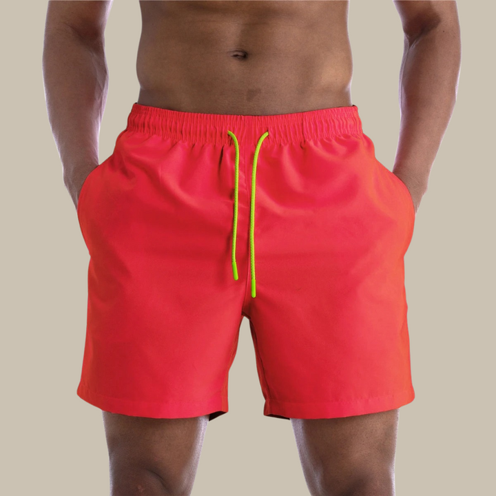 Men's casual quick-drying swim shorts with elastic waistband and lightweight design, ideal for active summer days by the water.






