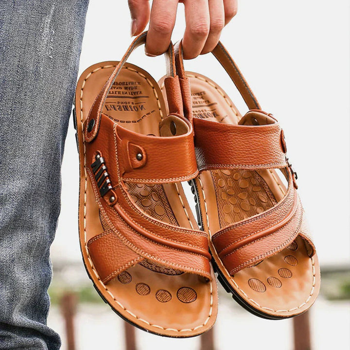 Men's supportive leather sandals with ergonomic footbed and adjustable straps, ideal for summer days.