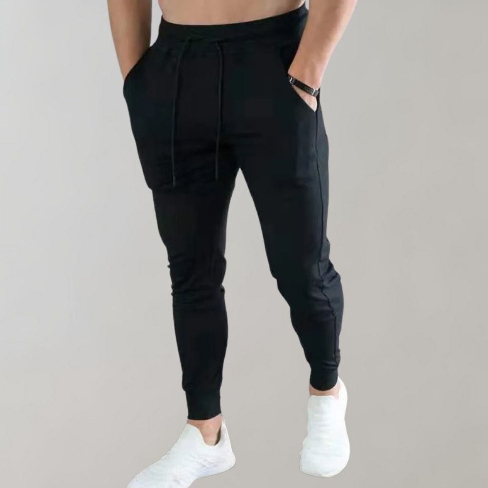 Men’s trendy slim-fit sweatpants with breathable fabric, elastic waistband, and versatile style, perfect for casual and summer wear.