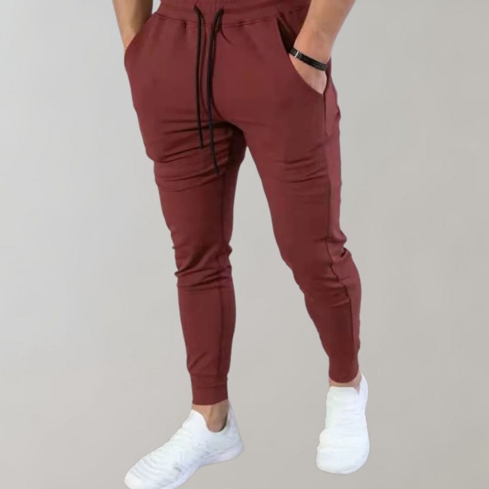 Men’s trendy slim-fit sweatpants with breathable fabric, elastic waistband, and versatile style, perfect for casual and summer wear.