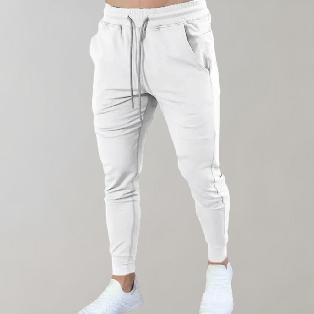 Men’s trendy slim-fit sweatpants with breathable fabric, elastic waistband, and versatile style, perfect for casual and summer wear.