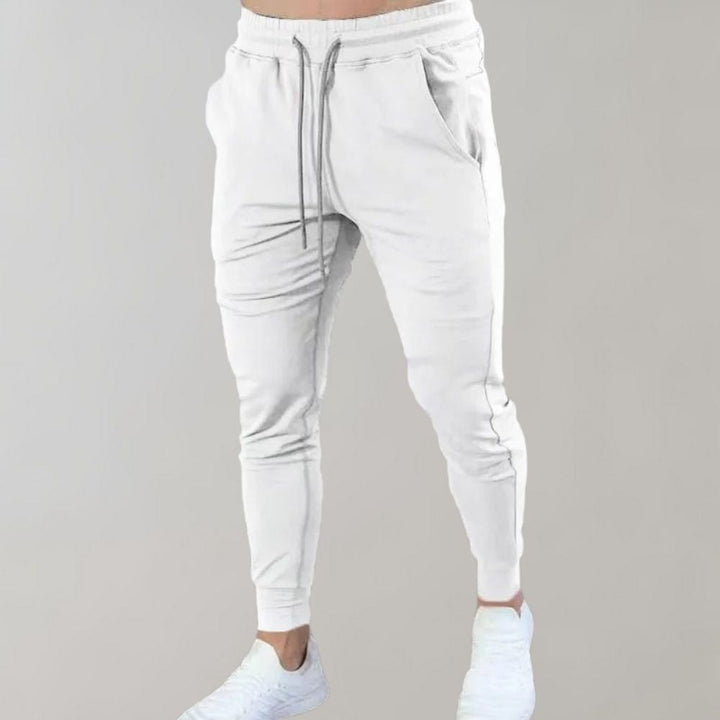 Men’s trendy slim-fit sweatpants with breathable fabric, elastic waistband, and versatile style, perfect for casual and summer wear.