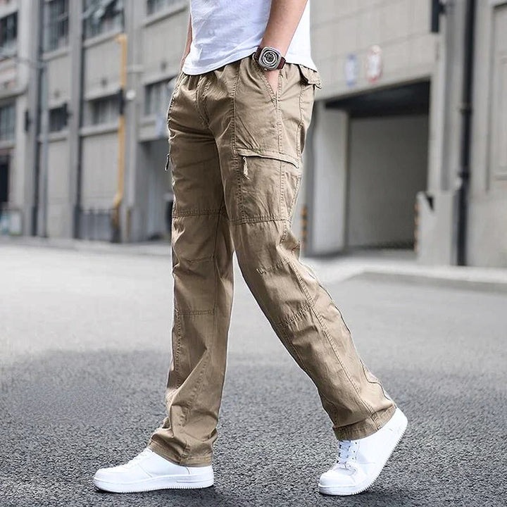 Premium men's cargo pants with multiple pockets, breathable fabric, and a relaxed yet stylish fit, perfect for summer days and casual outings.