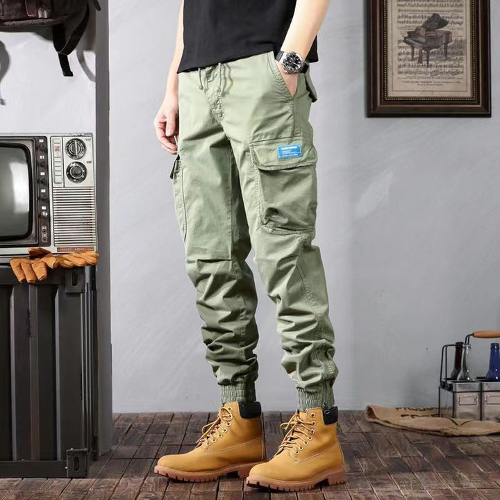 Premium tactical cargo pants with durable fabric, multiple pockets, and lightweight design, ideal for outdoor activities and summer wear.






