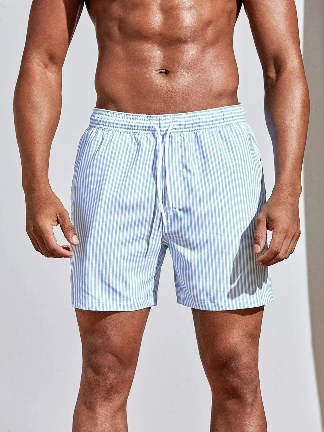  Soft men's swimming trunks with quick-drying fabric, lightweight comfort, and a secure fit, ideal for summer days at the beach or pool.
