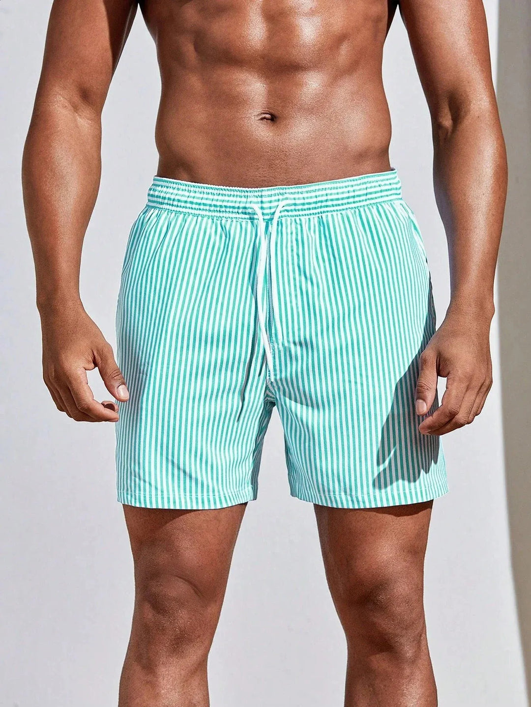  Soft men's swimming trunks with quick-drying fabric, lightweight comfort, and a secure fit, ideal for summer days at the beach or pool.
