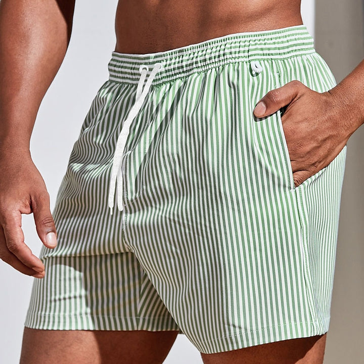  Soft men's swimming trunks with quick-drying fabric, lightweight comfort, and a secure fit, ideal for summer days at the beach or pool.






