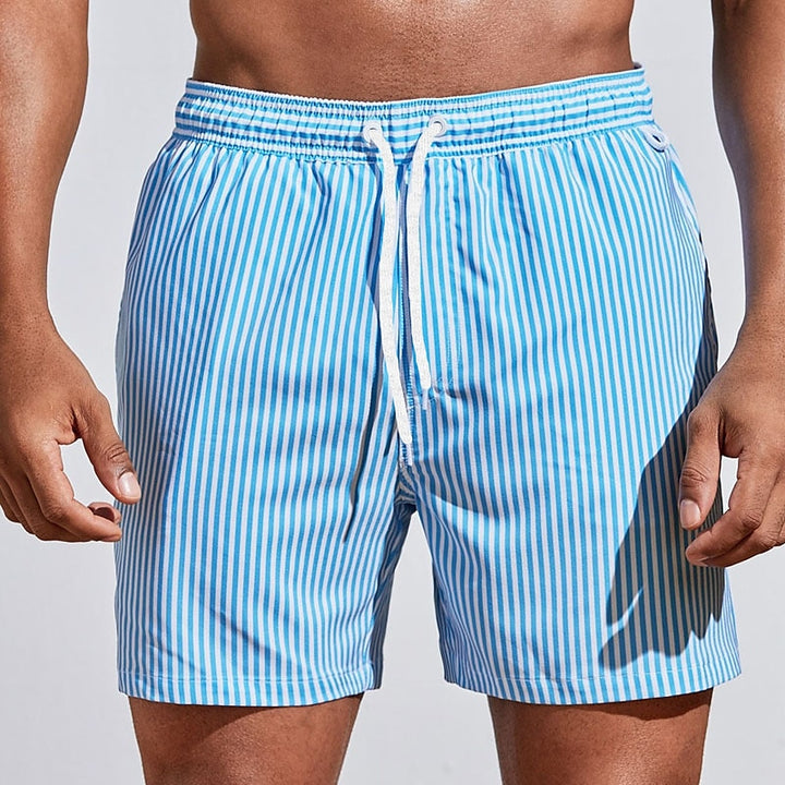  Soft men's swimming trunks with quick-drying fabric, lightweight comfort, and a secure fit, ideal for summer days at the beach or pool.






