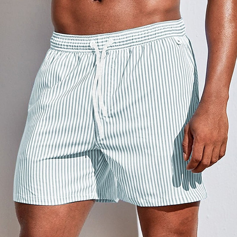  Soft men's swimming trunks with quick-drying fabric, lightweight comfort, and a secure fit, ideal for summer days at the beach or pool.






