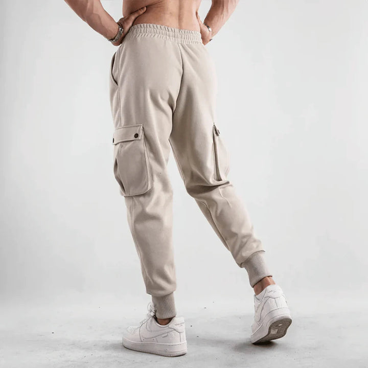 Stylish men's cargo joggers with breathable material, functional pockets, and a slim-fit design, perfect for summer days and casual outings.






