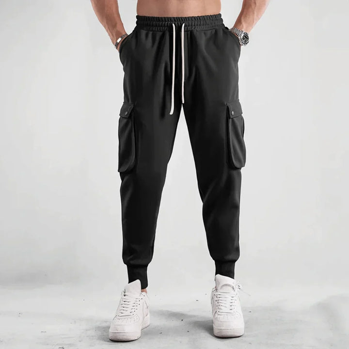 Stylish men's cargo joggers with breathable material, functional pockets, and a slim-fit design, perfect for summer days and casual outings.






