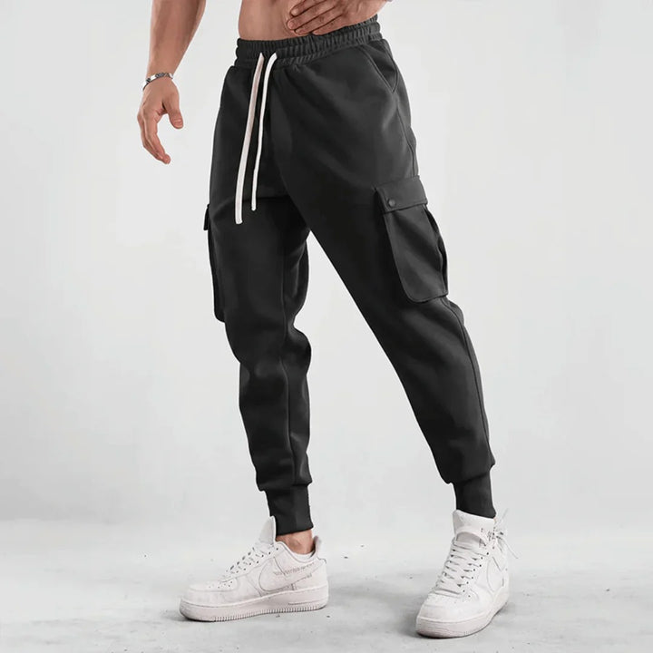 Stylish men's cargo joggers with breathable material, functional pockets, and a slim-fit design, perfect for summer days and casual outings.






