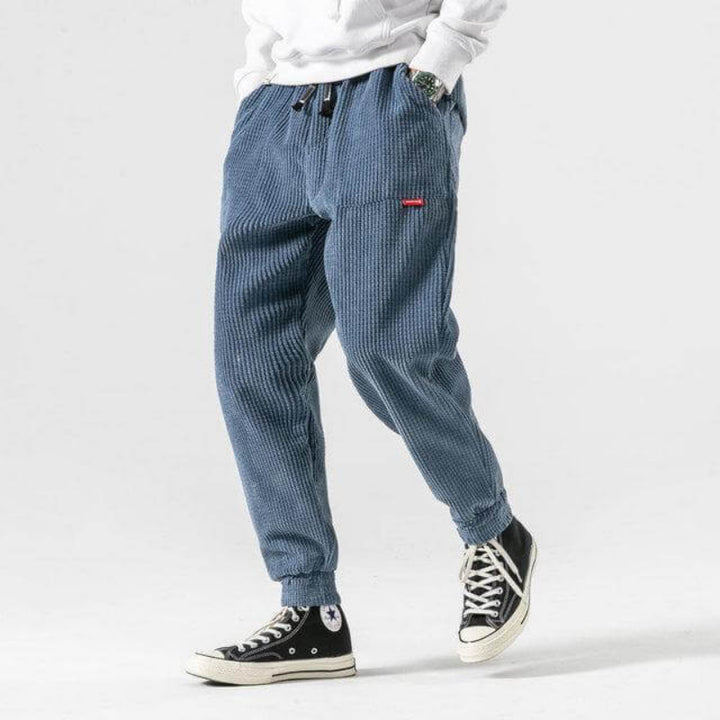 Trendy casual men's corduroy pants with a relaxed fit and breathable design, perfect for summer and versatile styling.