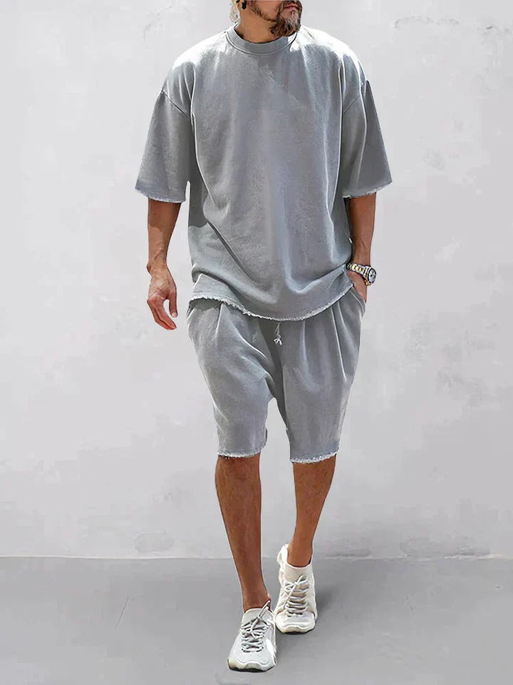 Trendy oversized shirt and shorts set, perfect for summer days, offering comfort and effortless style.