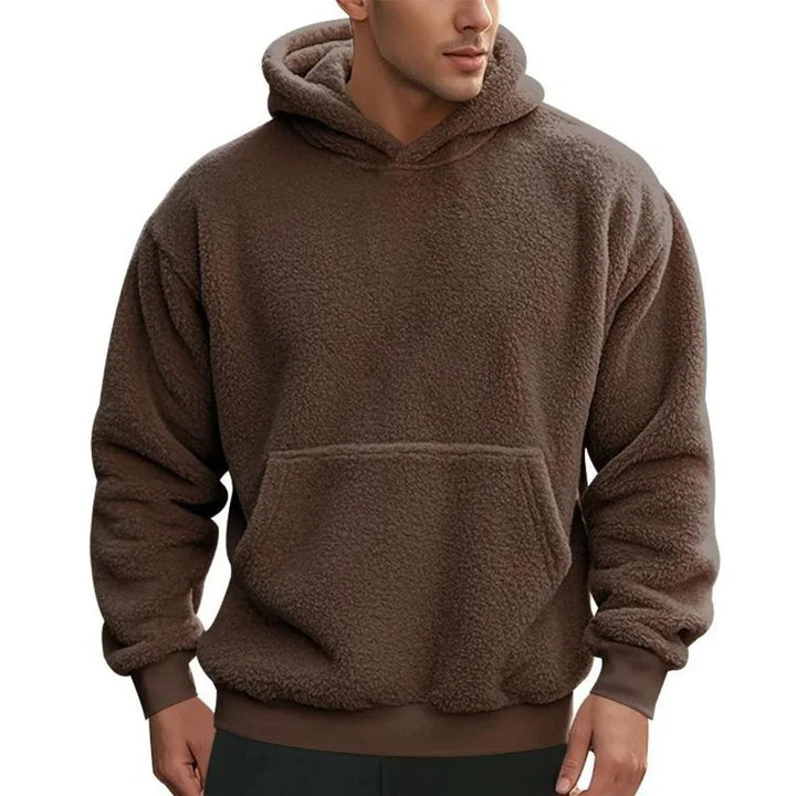 Warm men's hoodie with soft insulating fabric, breathable design, and a relaxed fit, ideal for autumn layering.







