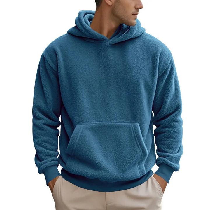 Warm men's hoodie with soft insulating fabric, breathable design, and a relaxed fit, ideal for autumn layering.







